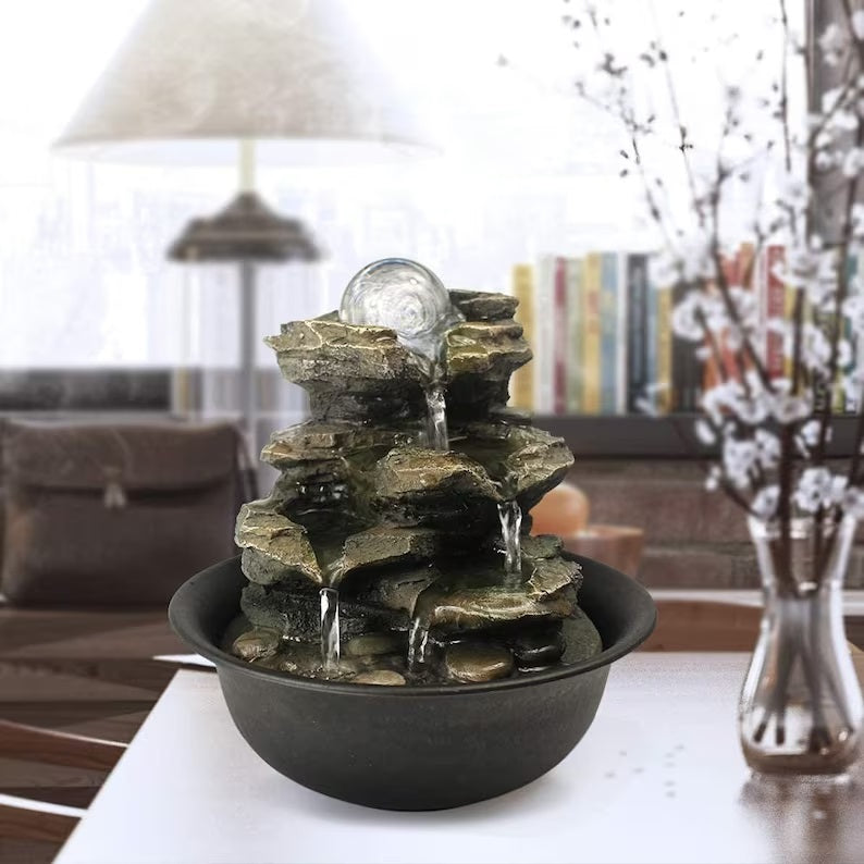 Decorative tabletop water feature with natural rocks