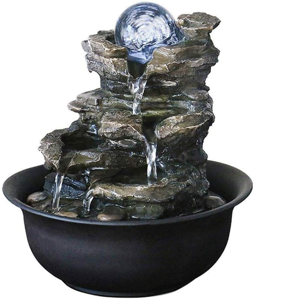 LED tabletop fountain used as a night light in bedroom