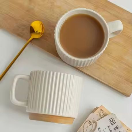 Ceramic mug with wooden base included in gift set
